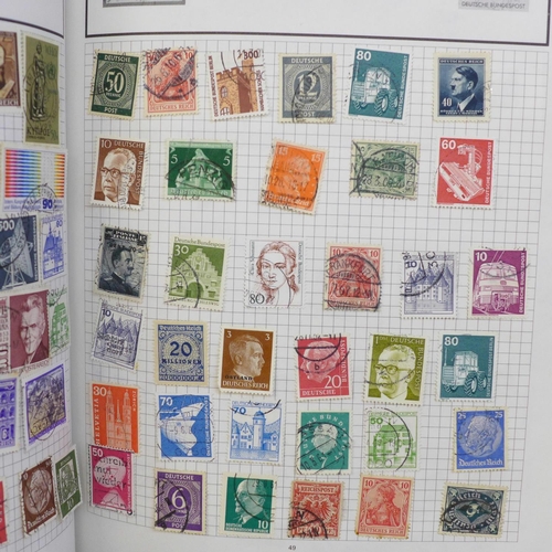 718 - Three stamp albums