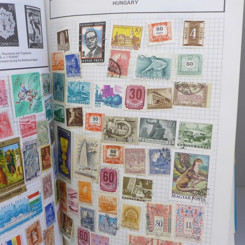 718 - Three stamp albums