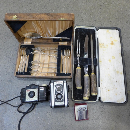 744 - Two boxed sets including a silver plated cutlery set and a three piece carving set, camera, Ronson l... 