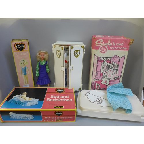 767 - A Sindy bed and bed clothes, wardrobe and Funtime doll with accessories