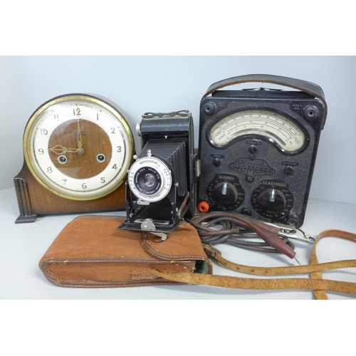 786 - A GRF Cope & Co. of Nottingham mantel clock, a voltmeter and a Brownie folding camera