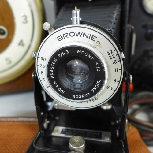 786 - A GRF Cope & Co. of Nottingham mantel clock, a voltmeter and a Brownie folding camera