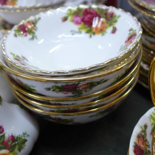 805 - A box of Royal Albert Old Country Roses, three tier cake stand, mugs, bowls, four dinner plates, sev... 