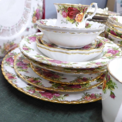 805 - A box of Royal Albert Old Country Roses, three tier cake stand, mugs, bowls, four dinner plates, sev... 