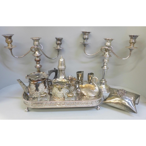 814 - A pair of silver plate on copper candelabra, lacking one sconce, a silver plate on copper tray, a th... 