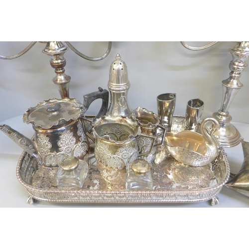 814 - A pair of silver plate on copper candelabra, lacking one sconce, a silver plate on copper tray, a th... 