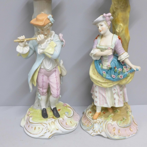 838 - Two continental figural candlesticks