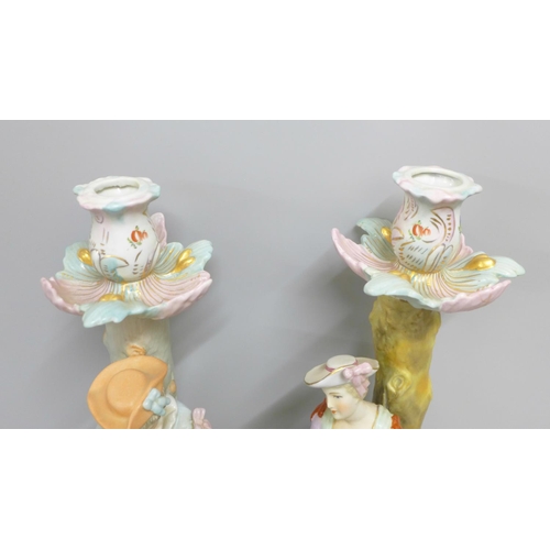 838 - Two continental figural candlesticks