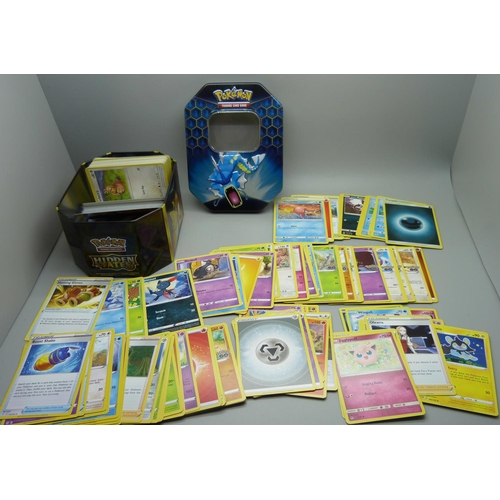 872 - 30 Reverse Holo/Holo Pokemon cards and 300 common/uncommon and rare cards in tin