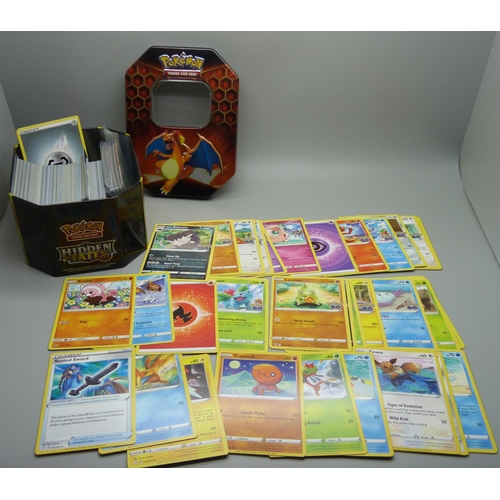 873 - 30 Reverse Holo/Holo Pokemon cards and 300 common/uncommon and rare cards in tin