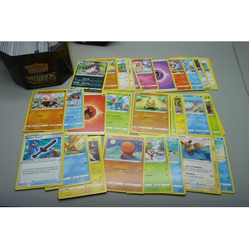 873 - 30 Reverse Holo/Holo Pokemon cards and 300 common/uncommon and rare cards in tin