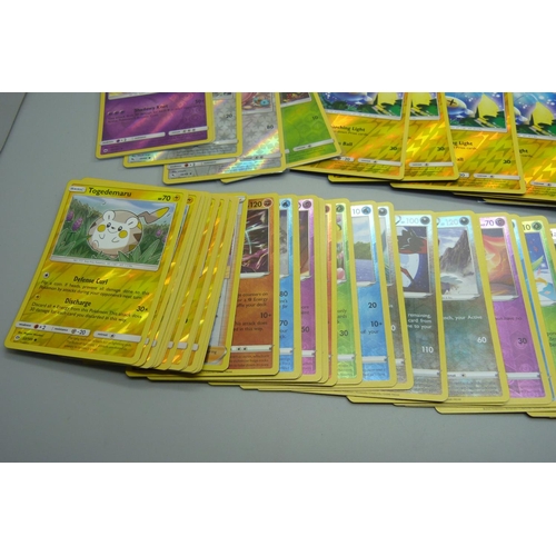 874 - 100 Reverse holographic Pokemon cards, multiple sets