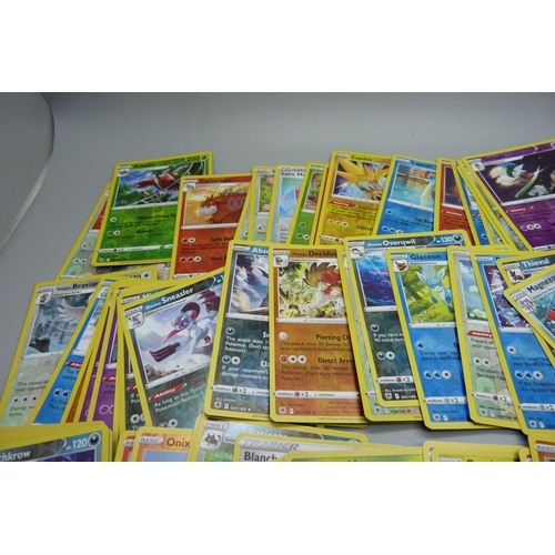 875 - 100 Reverse holographic Pokemon cards, multiple sets