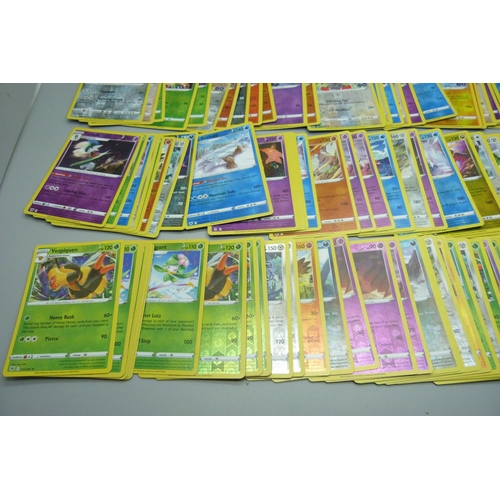 876 - 100 Reverse holographic Pokemon cards, multiple sets