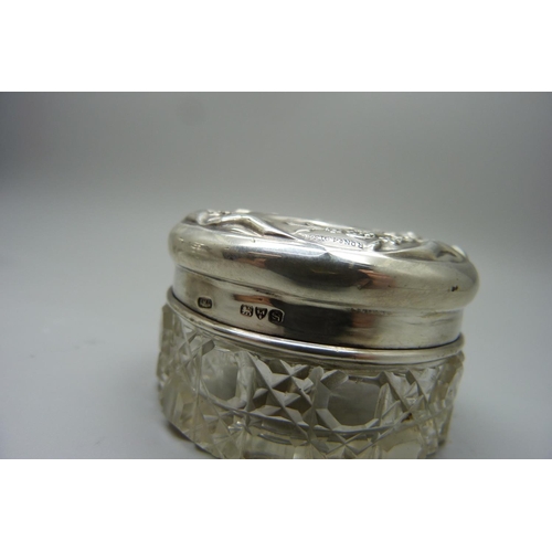 877 - Three silver topped glass jars, 29g