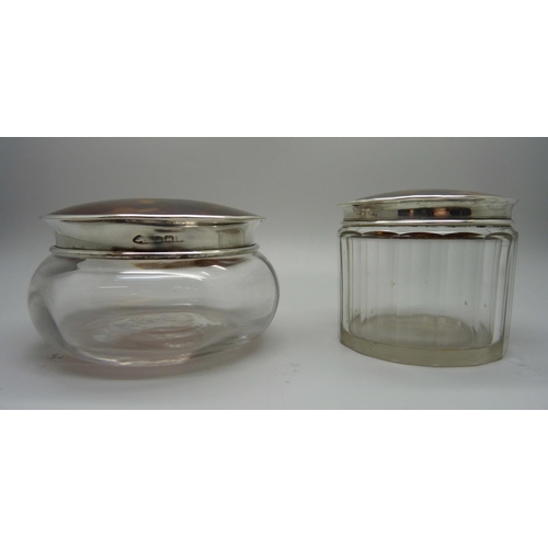 879 - Two silver and tortoiseshell topped glass jars