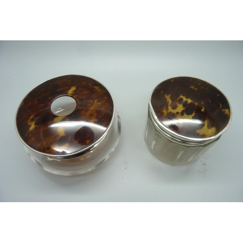 879 - Two silver and tortoiseshell topped glass jars