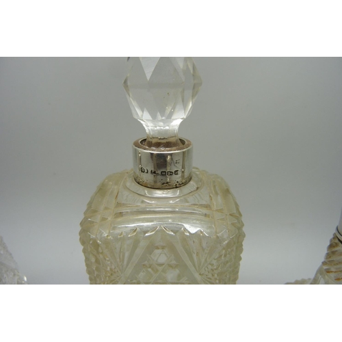 885 - Five silver mounted scent bottles