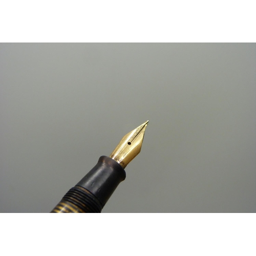 912 - A Parker Vacumatic ink pen with 14ct gold nib, a plated Parker ballpoint pen and a Parker 51 pen