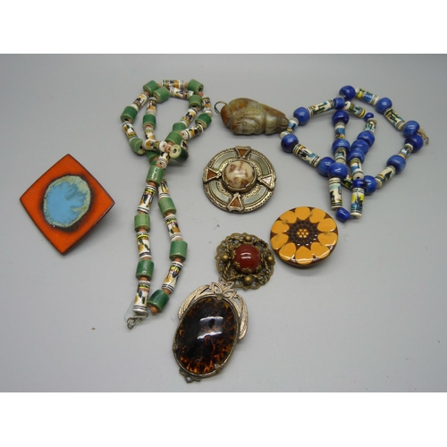 926 - Five brooches including Miracle and one marked Danmark, a carved pendant and two necklaces