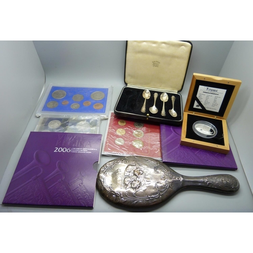 941 - A silver mirror, a/f, a silver Titanic Expedition 2000 medallion and other mint coin sets