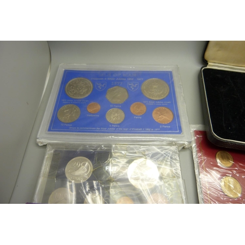 941 - A silver mirror, a/f, a silver Titanic Expedition 2000 medallion and other mint coin sets