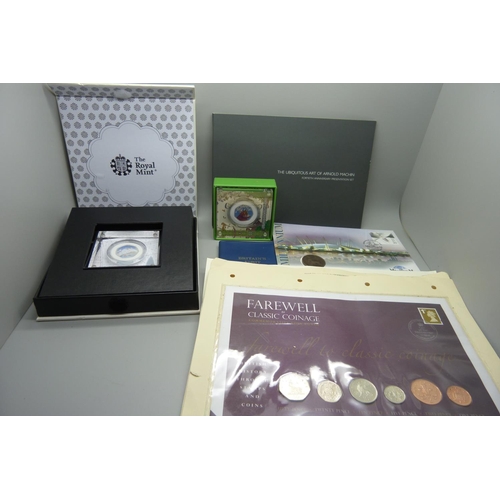 943 - Coins and coin covers; four coin covers along with Royal Mint presentation folders housing uncircula... 