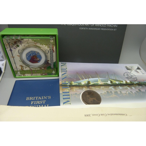 943 - Coins and coin covers; four coin covers along with Royal Mint presentation folders housing uncircula... 