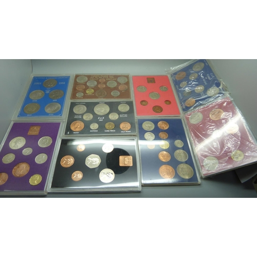 944 - Twenty-one mainly UK coin sets and a collection of commemorative crowns