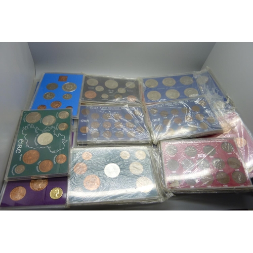 944 - Twenty-one mainly UK coin sets and a collection of commemorative crowns