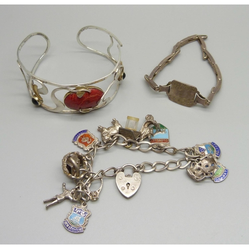 950 - A silver charm bracelet, one other silver bracelet and a bangle, bangle a/f