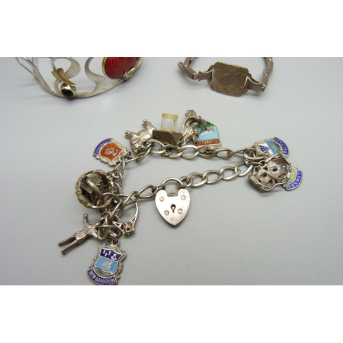 950 - A silver charm bracelet, one other silver bracelet and a bangle, bangle a/f