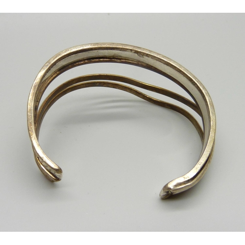 955 - A Renee Lepre (French designer) copper and sterling silver bangle