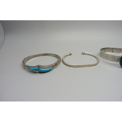 961 - Four silver bangles including turquoise and malachite set, 69g