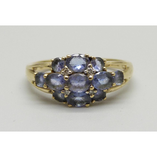 963 - A 9ct gold and tanzanite cluster ring, 2.2g, N