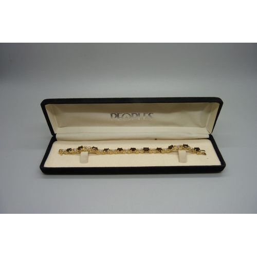 980 - A silver gilt, smoky quartz and eleven diamond bracelet