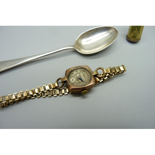 981 - A 9ct gold cased Rotary wristwatch, a/f, a silver spoon and a silver £1 charm