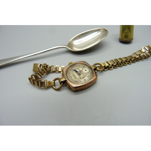 981 - A 9ct gold cased Rotary wristwatch, a/f, a silver spoon and a silver £1 charm