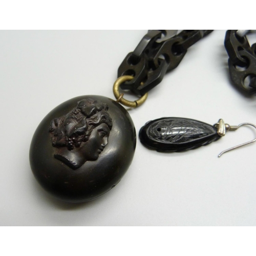 988 - A Victorian jet long guard chain and locket, locket hinge sale