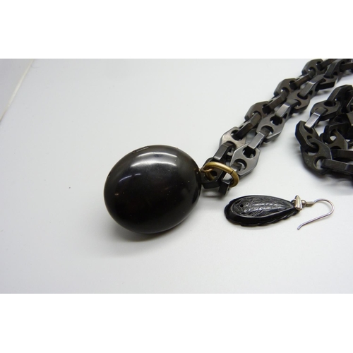 988 - A Victorian jet long guard chain and locket, locket hinge sale