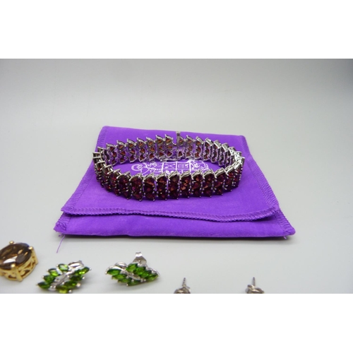 992 - A bracelet with ten pairs of sterling silver and semi precious stone earrings