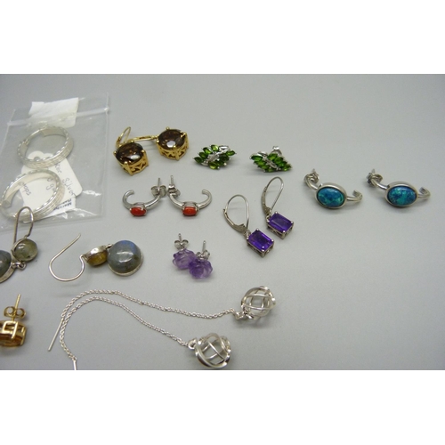 992 - A bracelet with ten pairs of sterling silver and semi precious stone earrings