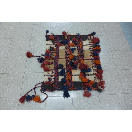 106 - A blue ground runner rug, small red ground rug and a donkey rug