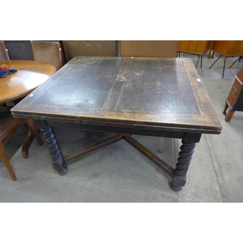 108 - An oak barleytwist draw-leaf table