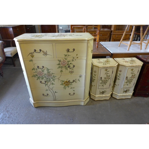 123 - An oriental cream lacquered chinoiserie chest of drawers and pair of bedside cabinets