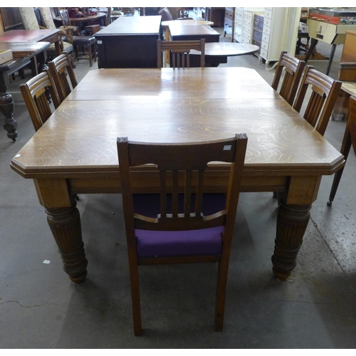 136 - A Victorian oak dining table and six chairs