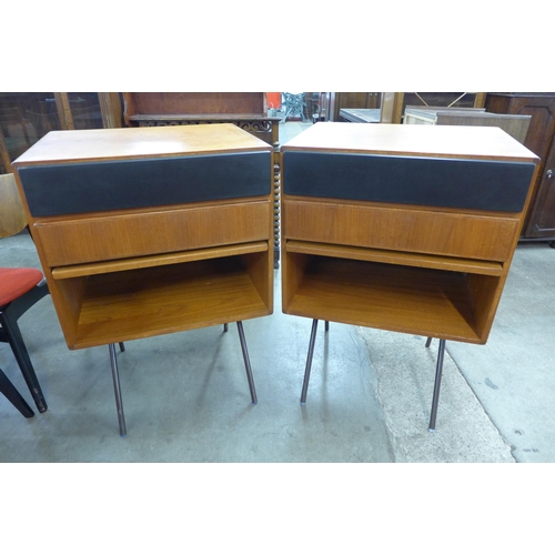 14 - A pair of Danish teak cabinets on black metal stands