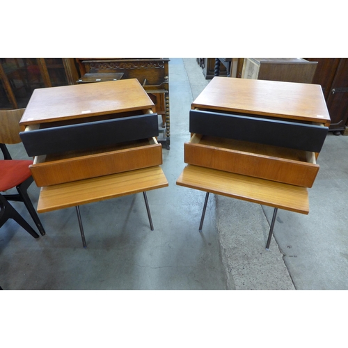 14 - A pair of Danish teak cabinets on black metal stands