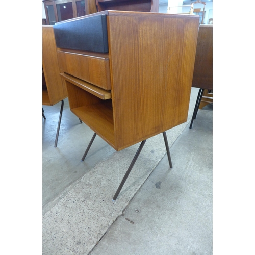 14 - A pair of Danish teak cabinets on black metal stands