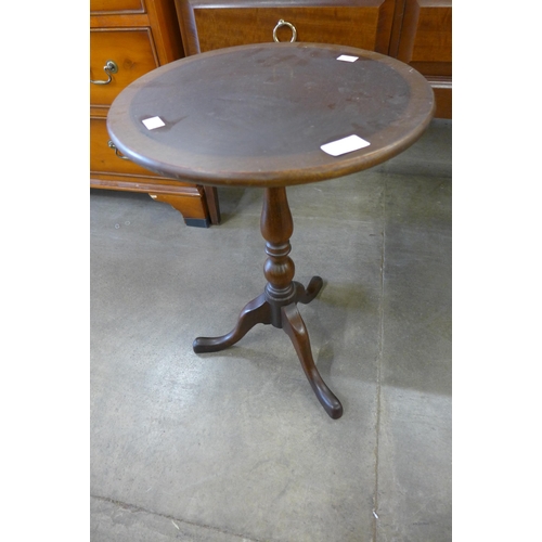 146 - An inlaid mahogany tripod wine table